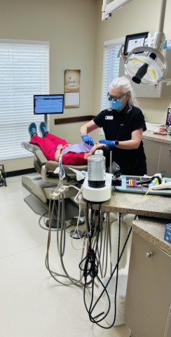 Karen working with a patient at Cooksey Dental